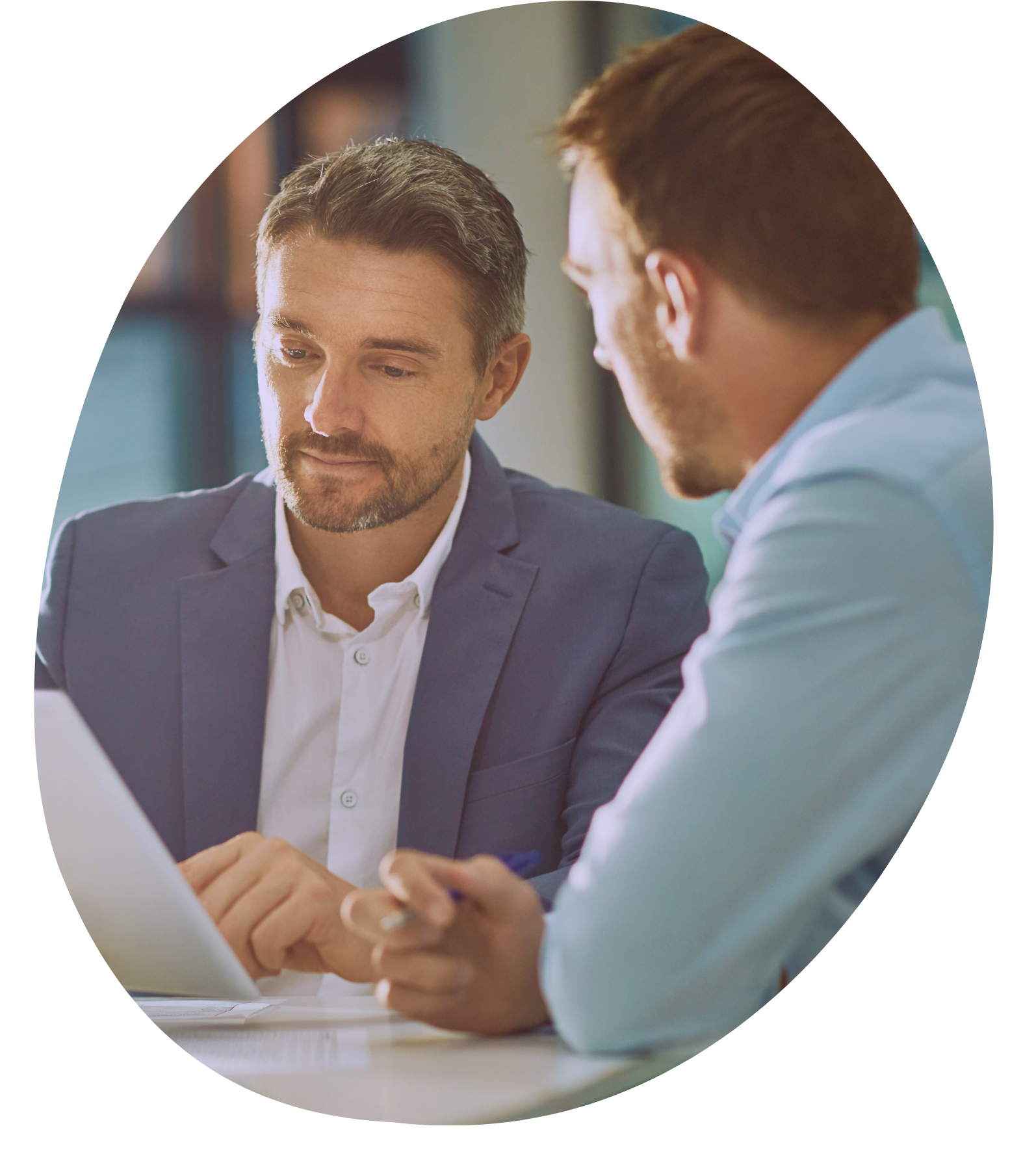 Colleagues talking together in a bright office
